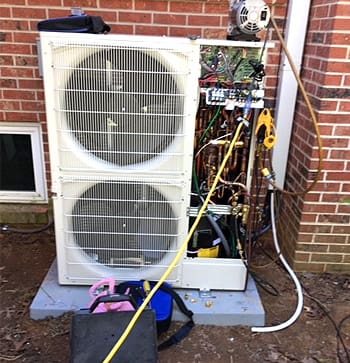 CAM Heating & Cooling | Etowah, NC | hvac unit being worked on