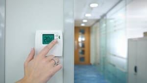 CAM Heating & Cooling | Etowah, NC | commercial heating and air thermostat in an office building down a hallway